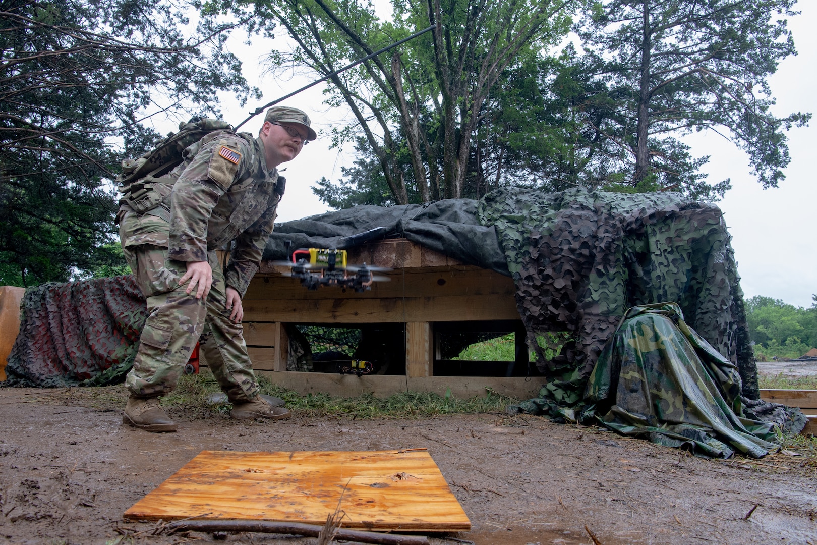 Staff Sgt. Andrew Carrick, a tactical unmanned aircraft system repairer assigned to Detachment 1, Delta Company, 545th Brigade Engineer Battalion, 45th Infantry Brigade Combat Team, acts as a safety observing a small first-person view drone launch during a UAS exercise at Camp Gruber Training Center, Oklahoma, on June 12, 2025. The exercise, hosted by the 45th IBCT and featured numerous UAS and counter-UAS systems, focused on preparing infantry Soldiers to react to UAS threats. (Oklahoma National Guard photo by Staff Sgt. Anthony Jones)