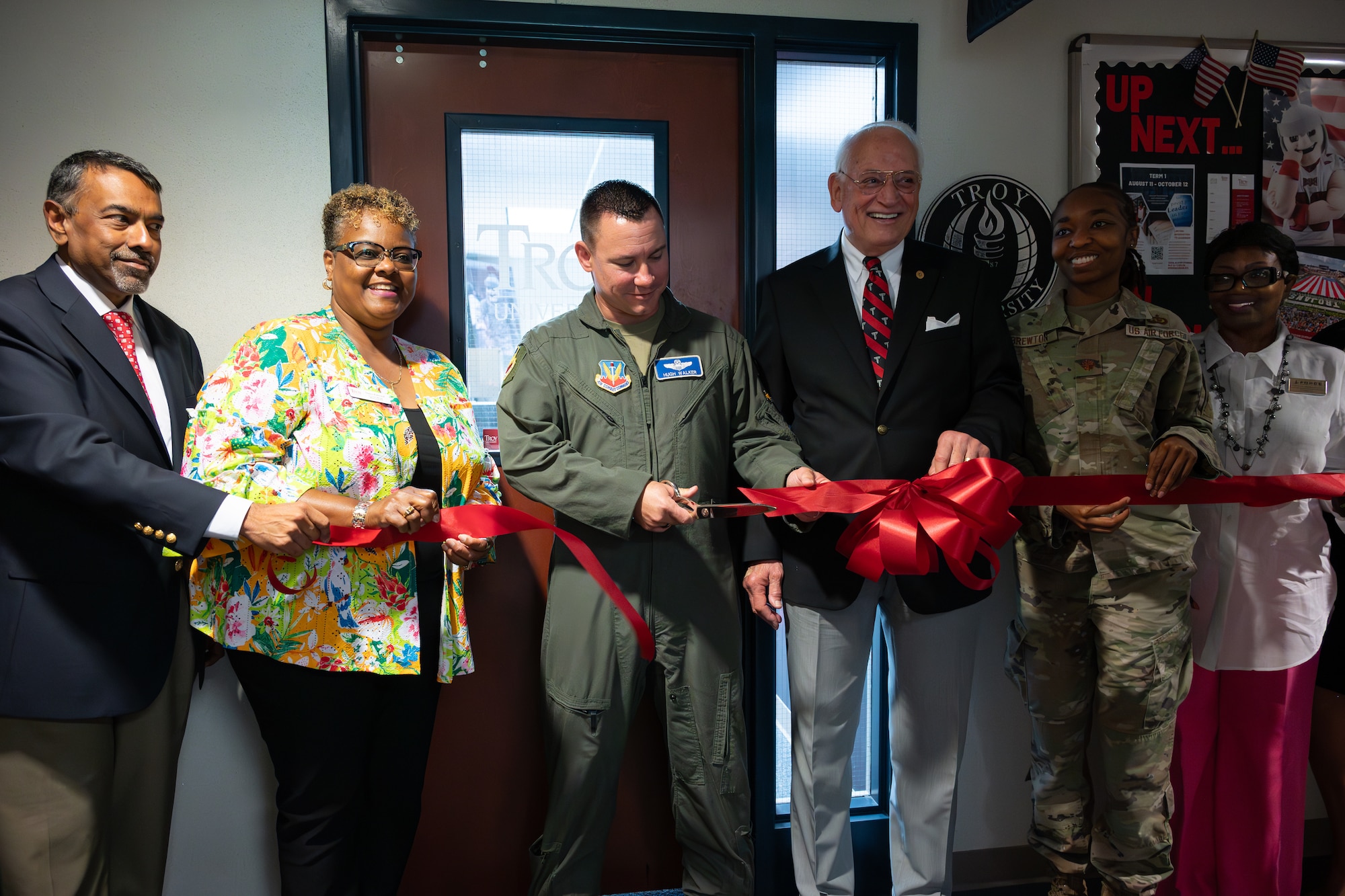 U.S. Airmen, civilians and Troy University representatives gather  for a ribbon-cutting ceremony celebrating Troy's new on-site campus at Shaw Air Force Base, S.C., June 17, 2025.