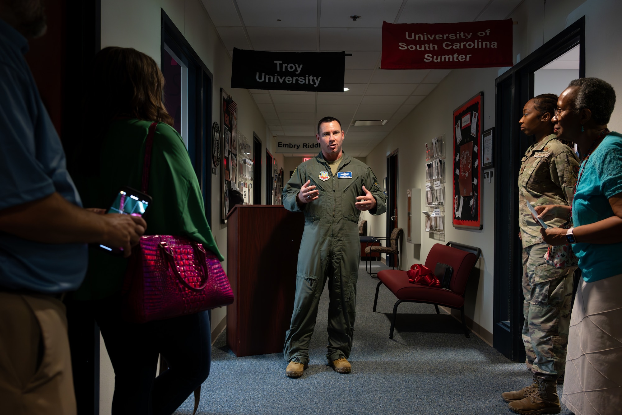 U.S. Airmen, civilians and Troy University representatives gather  for a ribbon-cutting ceremony celebrating Troy's new on-site campus at Shaw Air Force Base, S.C., June 17, 2025.