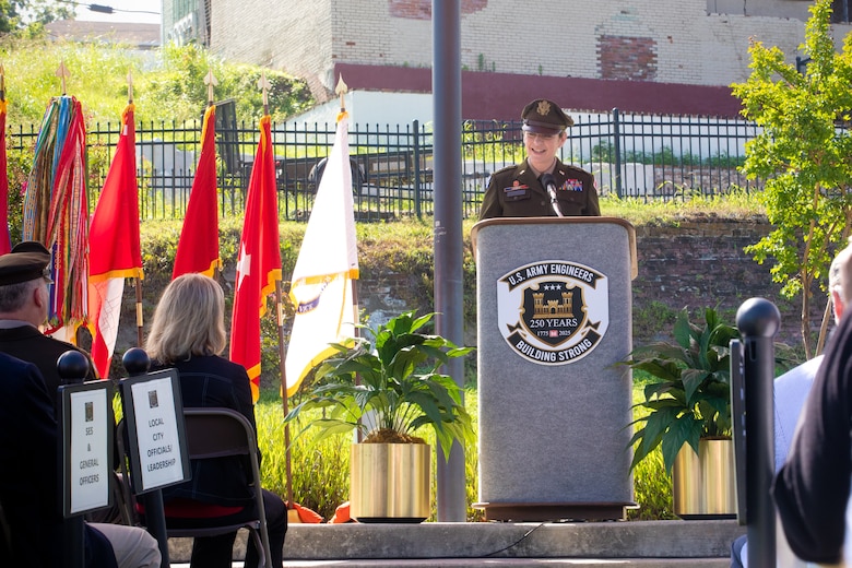 Maj. Gen. Kimberly Peeples stands at podium