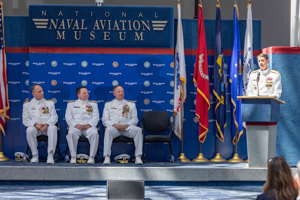 Rear Adm. Gregory Huffman, commander, Naval Education and Training Command (NETC), delivers remarks during NETC’s change of command ceremony at the National Naval Aviation Museum onboard Naval Air Station Pensacola, Florida, June 18, 2025. Rear Adm. Gregory Huffman relieved Rear Adm. Jeffrey Czerewko and became the 22nd commander of NETC. NETC's mission is to recruit, train and deliver those who serve our nation, taking them from street-to-fleet by forging civilians into highly skilled, operational and combat-ready warfighters. (United States Navy photo by Mass Communication Specialist 1st Class Zachary Melvin)