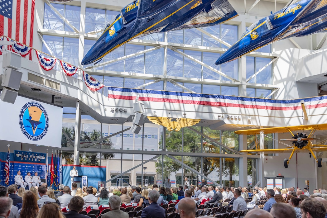 Rear Adm. Gregory Huffman, commander, Naval Education and Training Command (NETC), delivers remarks during NETC’s change of command ceremony at the National Naval Aviation Museum onboard Naval Air Station Pensacola, Florida, June 18, 2025. Rear Adm. Gregory Huffman relieved Rear Adm. Jeffrey Czerewko and became the 22nd commander of NETC. NETC's mission is to recruit, train and deliver those who serve our nation, taking them from street-to-fleet by forging civilians into highly skilled, operational and combat-ready warfighters. (United States Navy photo by Mass Communication Specialist 1st Class Zachary Melvin)