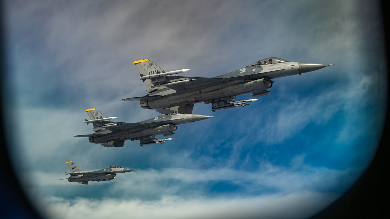 3 F-16s fly