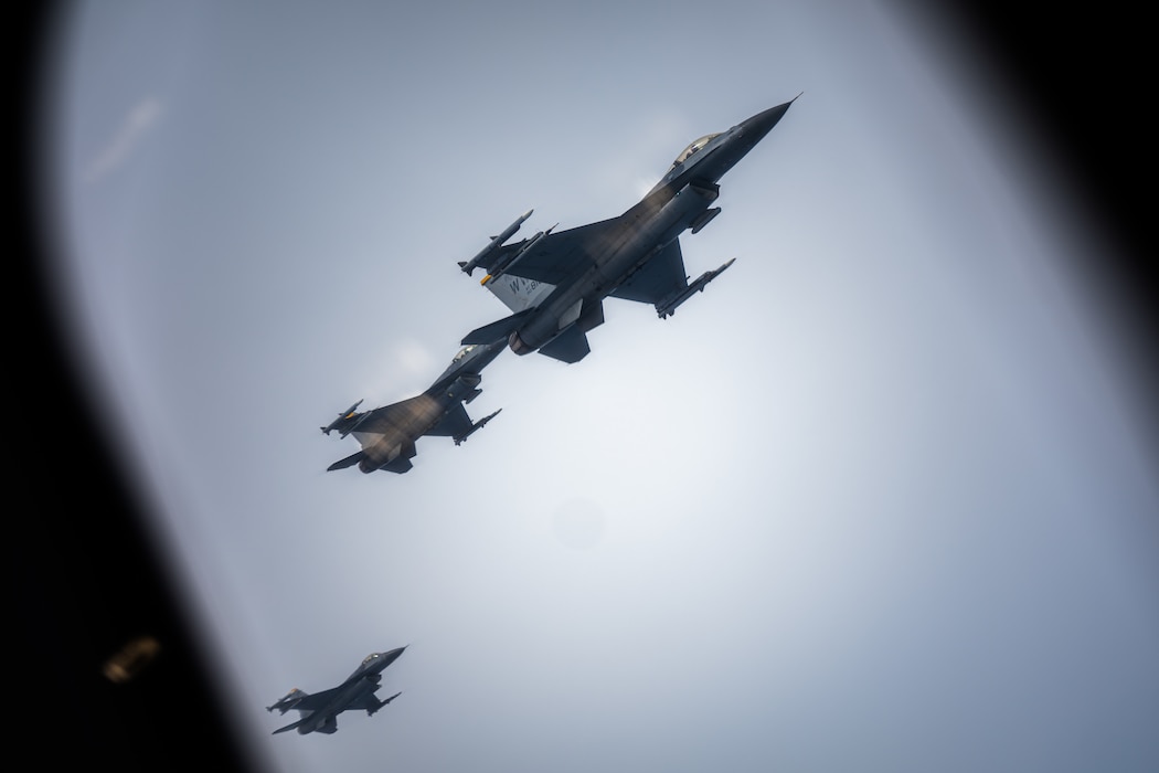 3 F-16s fly
