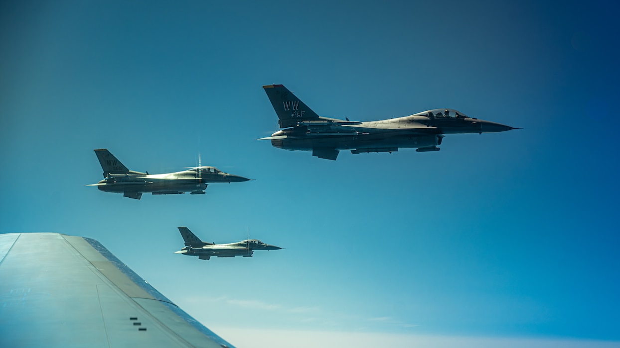 3 F-16s fly