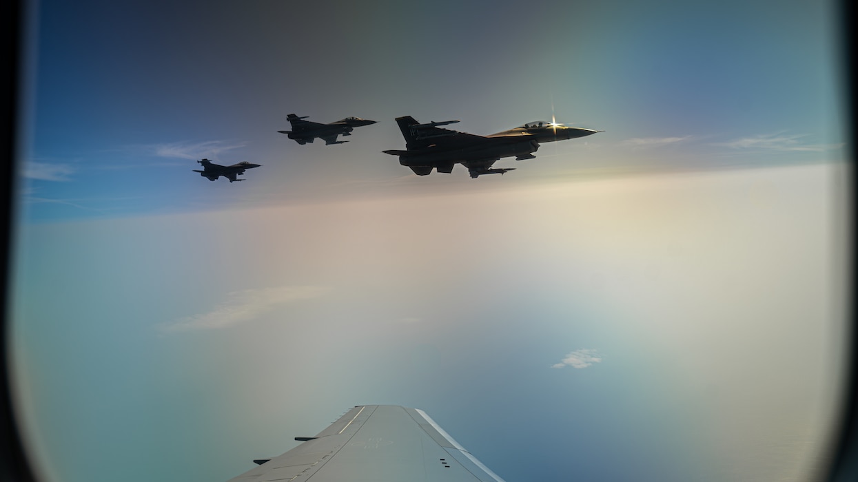 3 F-16s fly