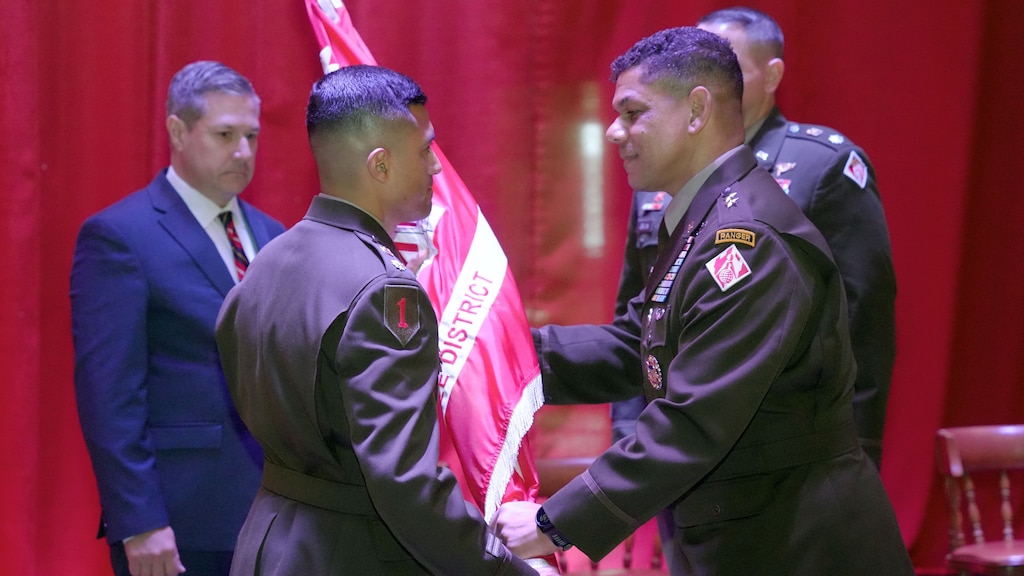Maj. Gen. Mark C. Quander(Right), U.S. Army Corps of Engineers Great Lakes and Ohio River Division commander, passes the Nashville District flag to Lt. Col. Guillermo Guandique as he took command of the Nashville District during a change of command ceremony June 18, 2025, at the Grand Lodge of Tennessee  in Nashville, Tennessee. (USACE photo by Noe Gonzalez)
