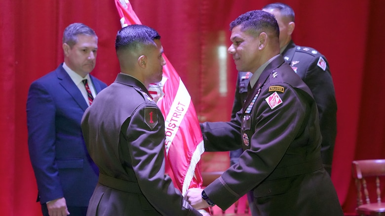 Maj. Gen. Mark C. Quander(Right), U.S. Army Corps of Engineers Great Lakes and Ohio River Division commander, passes the Nashville District flag to Lt. Col. Guillermo Guandique as he took command of the Nashville District during a change of command ceremony June 18, 2025, at the Grand Lodge of Tennessee  in Nashville, Tennessee. (USACE photo by Noe Gonzalez)