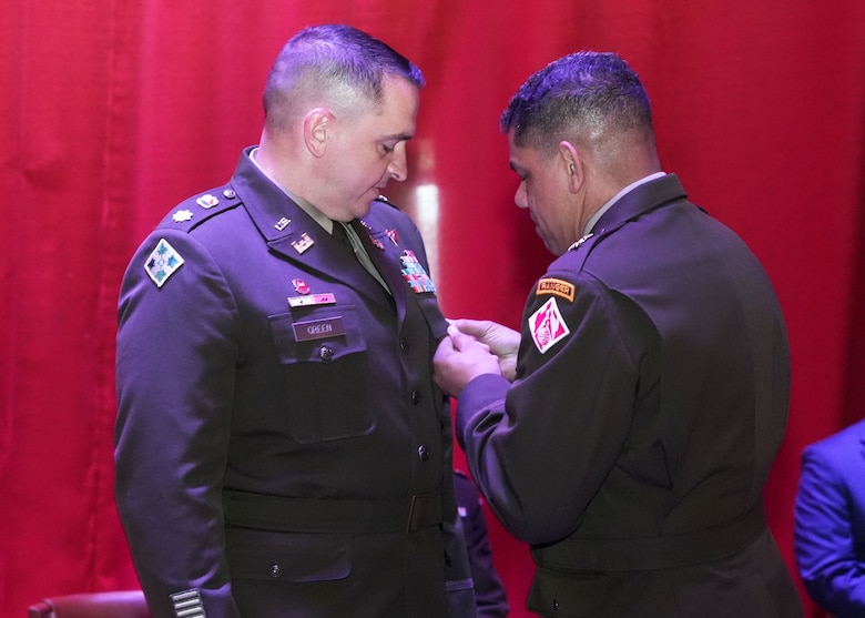 Maj. Gen. Mark C. Quander (Right), U.S. Army Corps of Engineers Great Lakes and Ohio River Division commanding general, presented the United States Meritorious Service Medal to Lt. Col. Robert Green during Green's retirement ceremony and change of command for the U.S. Army Corps of Engineers Nashville District at the Grand Lodge of Tennessee. (USACE photo by Noe Gonzalez)