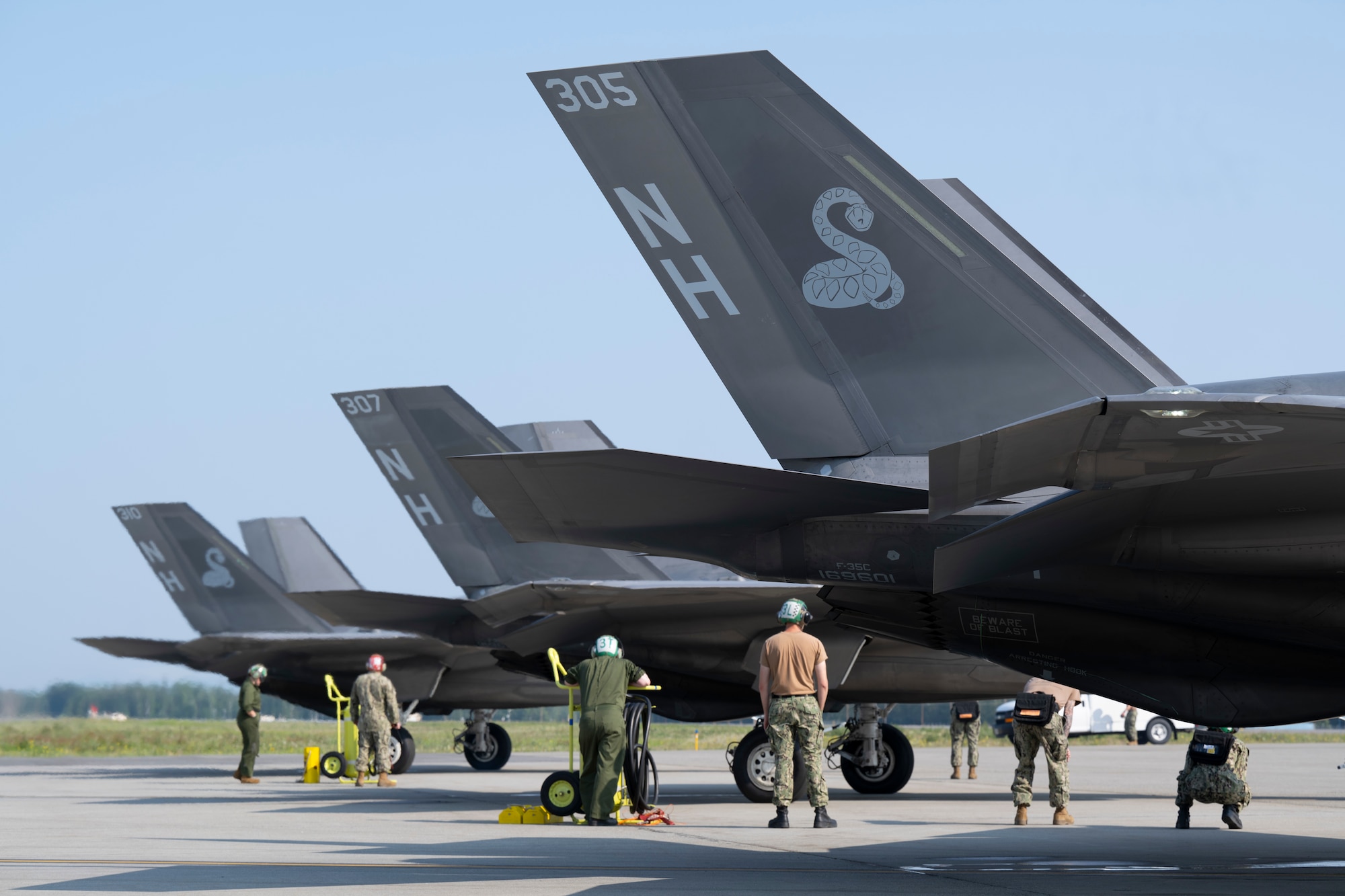 U.S. Navy sailors prepare F-35C Lightning IIs for takeoff during Red Flag-Alaska 25-2 at Eielson Air Force Base, Alaska, June 18, 2025.