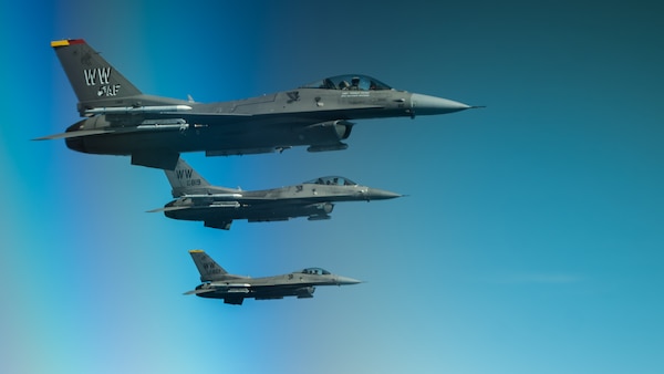 3 F-16s fly