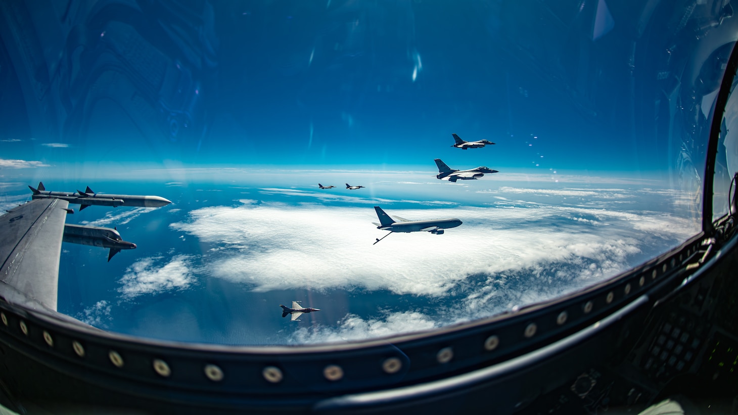 A KC-46 refuels F-16s as seen from an F-16 cockpit