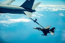 A KC-46 refuels an F-16