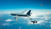 A KC-46 refuels F-16s