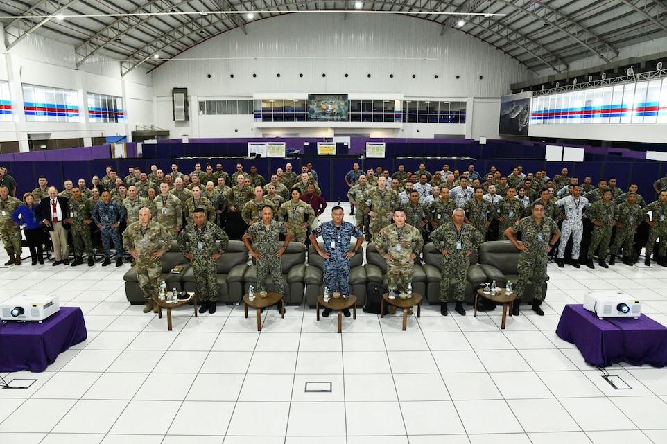 U.S. and Malaysian Armed Forces service members pose for a group photo during the Bersama Warrior 25 opening ceremony at the Joint Warfighting Center, Kuantan, Malaysia, June 17, 2025.