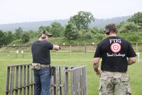 A competitor engages steel targets during the 2025 FTIG 2-Gun Steel Shoot at Fort Indiantown Gap, Pennsylvania, June 14, 2025.
