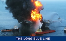 An April 2010 photograph of the Deepwater Horizon offshore oilrig after the explosion that set it on fire and caused its record-breaking oil spill. (U.S. Coast Guard)