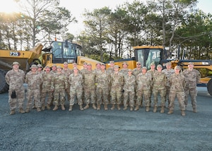 Pennsylvania Air National Guardsmen, assigned to the 171st Civil Engineer Squadron pose for a photo during a deployment for training, Assateague Island, Virginia, June 18, 2025. The 171st engineers are the 5th rotation of 8 during the deployment for training on the island. The DFT has provided engineers with unique training consistent with installing a runway while creating a new road for the Fish and Wildlife Service. (U.S. Air National Guard photo by Senior Master Sgt. Bryan Hoover)