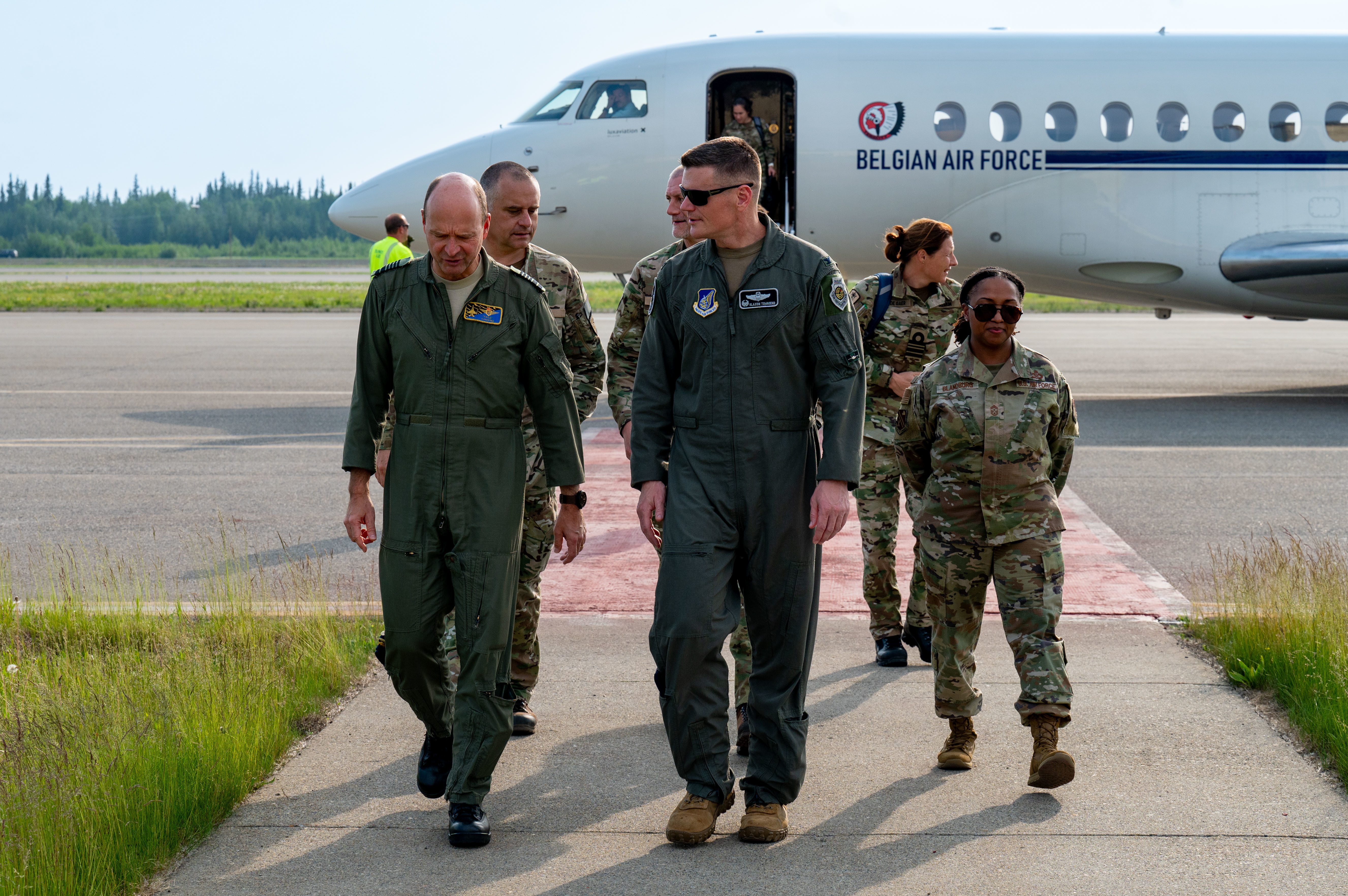 U.S. Air Force Col. Paul Townsend, 354th Fighter Wing commander, escorts Belgian Armed Forces Gen. Frederik Vansina, Belgian Chief of Defence, onto Eielson Air Force Base, Alaska, June 19, 2025. The visit included a brief on Red Flag Alaska, a unique opportunity to integrate various forces into joint, combined training from simulated forward operating bases with a long history of including allies and partners. (U.S. Air Force photo by Senior Airman Landon Gunsauls)