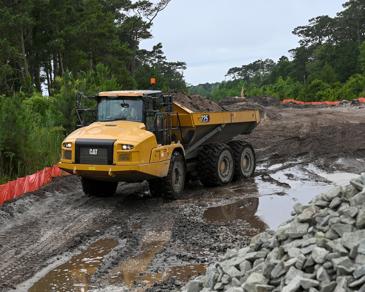 Pennsylvania Air National Guardsman assigned to the 171st Civil Engineer Squadron, operates an articulated dump truck (rock hauler) to move debris during a deployment for training, Assateague Island, Virginia, June 17, 2025. The 171st engineers are the 5th rotation of 8 during the deployment for training on the island. The DFT has provided engineers with unique training consistent with installing a runway while creating a new road for the Fish and Wildlife Service. (U.S. Air National Guard photo by Senior Master Sgt. Bryan Hoover)