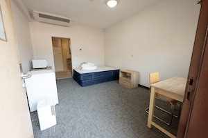 Air Force building 1080 dormitories at Incirlik Air Base, Türkiye, sit waiting to welcome new Airmen to the base, May 27, 2025. The nine facilities currently house over 600 Airmen, offering access to kitchens and laundry, spaces for relaxation, and opportunities for building community. (U.S. Air Force photo by Senior Airman Greydon Furstenau)