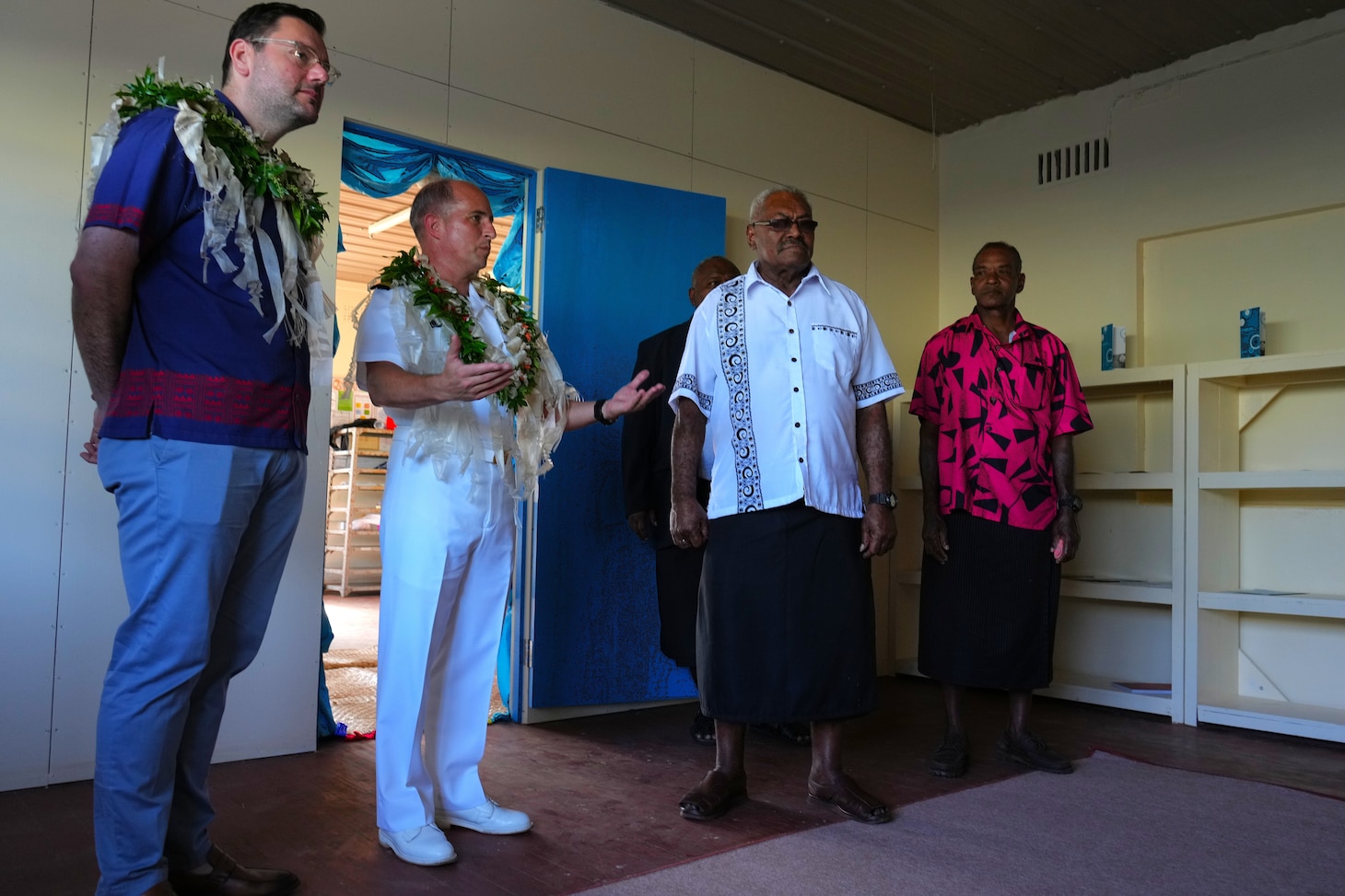 SUVA, Fiji (June 16, 2025) Capt. Mark B. Stefanik, center left, mission commander of Pacific Partnership 2025 (PP-25), shows Mr. Samuela Togenavanua, local tribe leader of Suva, and other local dignitaries a newly renovated classroom at Waiqanake District School as part of PP-25 in Suva, Fiji, June 16, 2025. Now in its 21st iteration, the Pacific Partnership series is the largest annual multinational humanitarian assistance and disaster management preparedness mission conducted in the Indo-Pacific. Pacific Partnership works collaboratively with host and partner nations to enhance regional interoperability and disaster response capabilities, increase security and stability in the region, and foster new and enduring friendships in the Indo-Pacific. (U.S. Navy photo by Mass Communication Specialist 2nd Class Moises Sandoval/Released)
