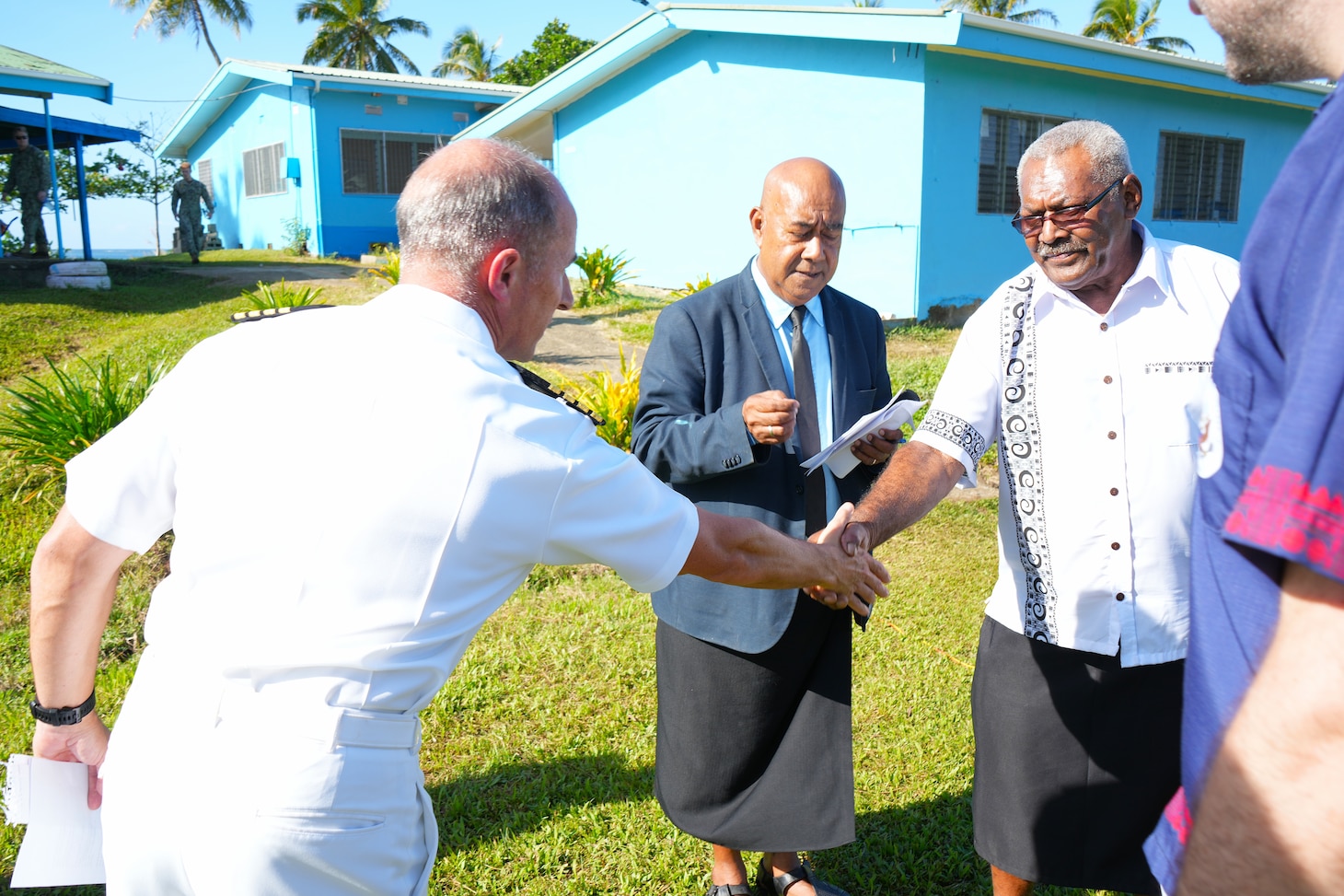 SUVA, Fiji (June 16, 2025) Capt. Mark B. Stefanik, left, mission commander of Pacific Partnership 2025, greets Mr. Samuela Togenavanua, local tribe leader of Suva, during a ribbon-cutting ceremony at Waiqanake District School in Suva, Fiji, June 16, 2025. Now in its 21st iteration, the Pacific Partnership series is the largest annual multinational humanitarian assistance and disaster management preparedness mission conducted in the Indo-Pacific. Pacific Partnership works collaboratively with host and partner nations to enhance regional interoperability and disaster response capabilities, increase security and stability in the region, and foster new and enduring friendships in the Indo-Pacific. (U.S. Navy photo by Mass Communication Specialist 2nd Class Moises Sandoval/Released)