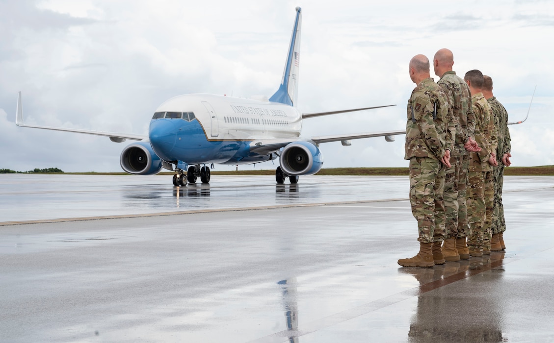 C-40B on flightline with Airmen standing nearby