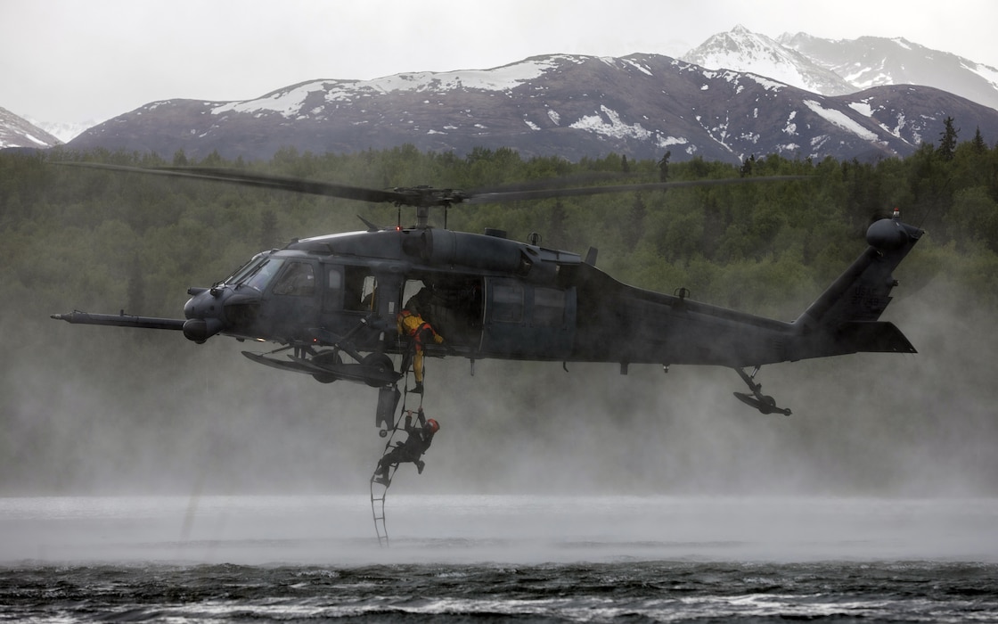 HH-60G hovering over water