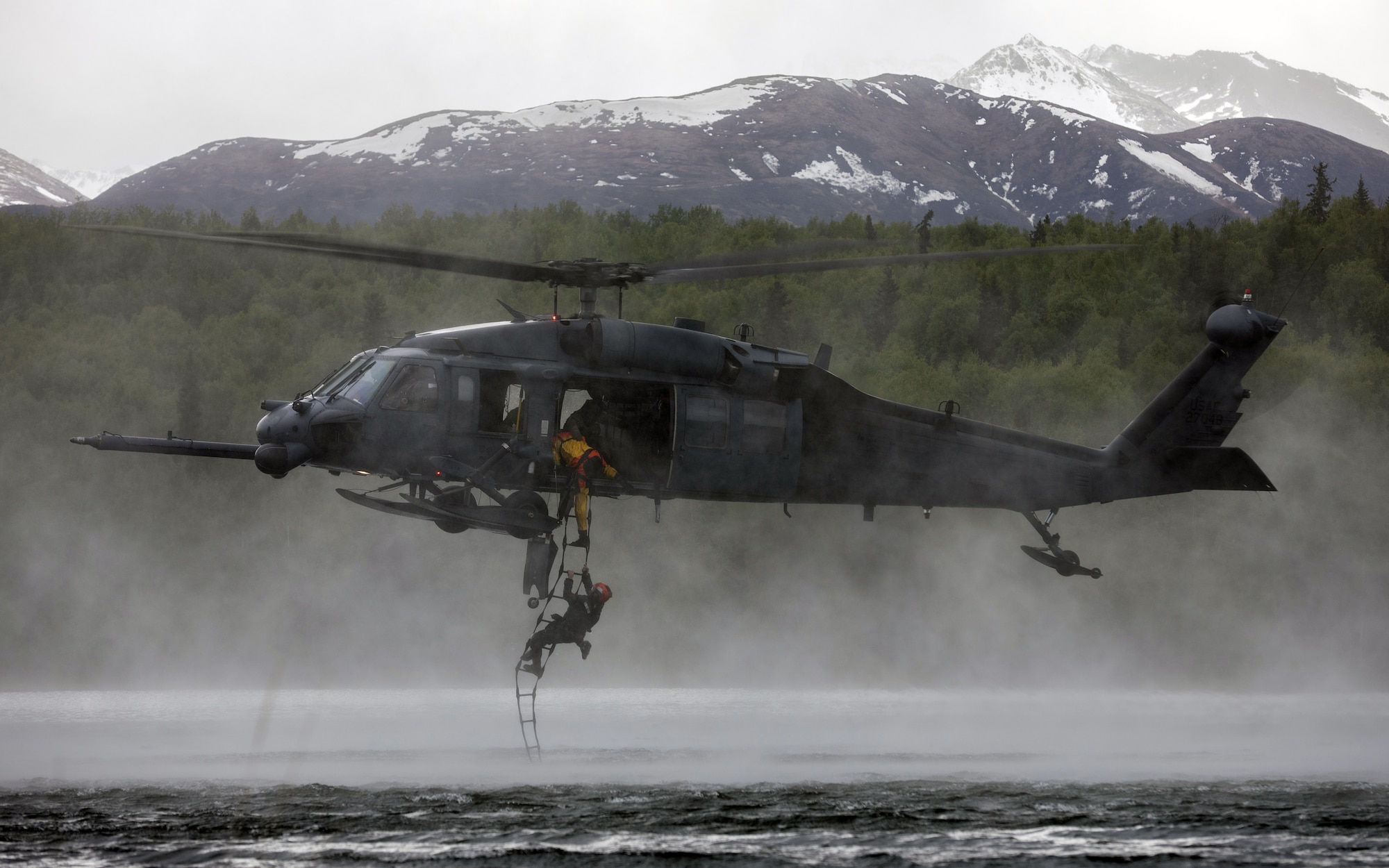 HH-60G hovering over water