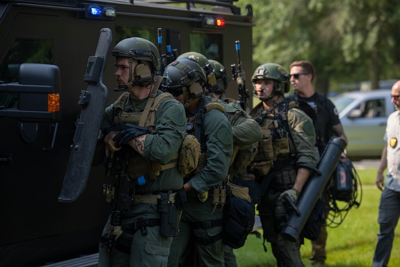 U.S. Marines with Marine Corps Base Quantico Provost Marshal Office’s special reaction teams advance to Lejeune Hall during an active shooter response exercise on MCBQ, June 11, 2025. Quantico hosted a multi-jurisdictional active shooter exercise designed to strengthen first responders capabilities in emergency response and public safety operations to improve interagency communication and coordination. (U.S. Marine Corps photo by Lance Cpl. Federico Marquez)