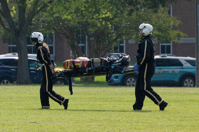First responders with PHI Air Medical advance to Lejeune hall during an active shooter response exercise on MCBQ, June 11, 2025. Quantico hosted a multi-jurisdictional active shooter exercise designed to strengthen first responders capabilities in emergency response and public safety operations to improve interagency communication and coordination. (U.S. Marine Corps photo by Lance Cpl. Federico Marquez)