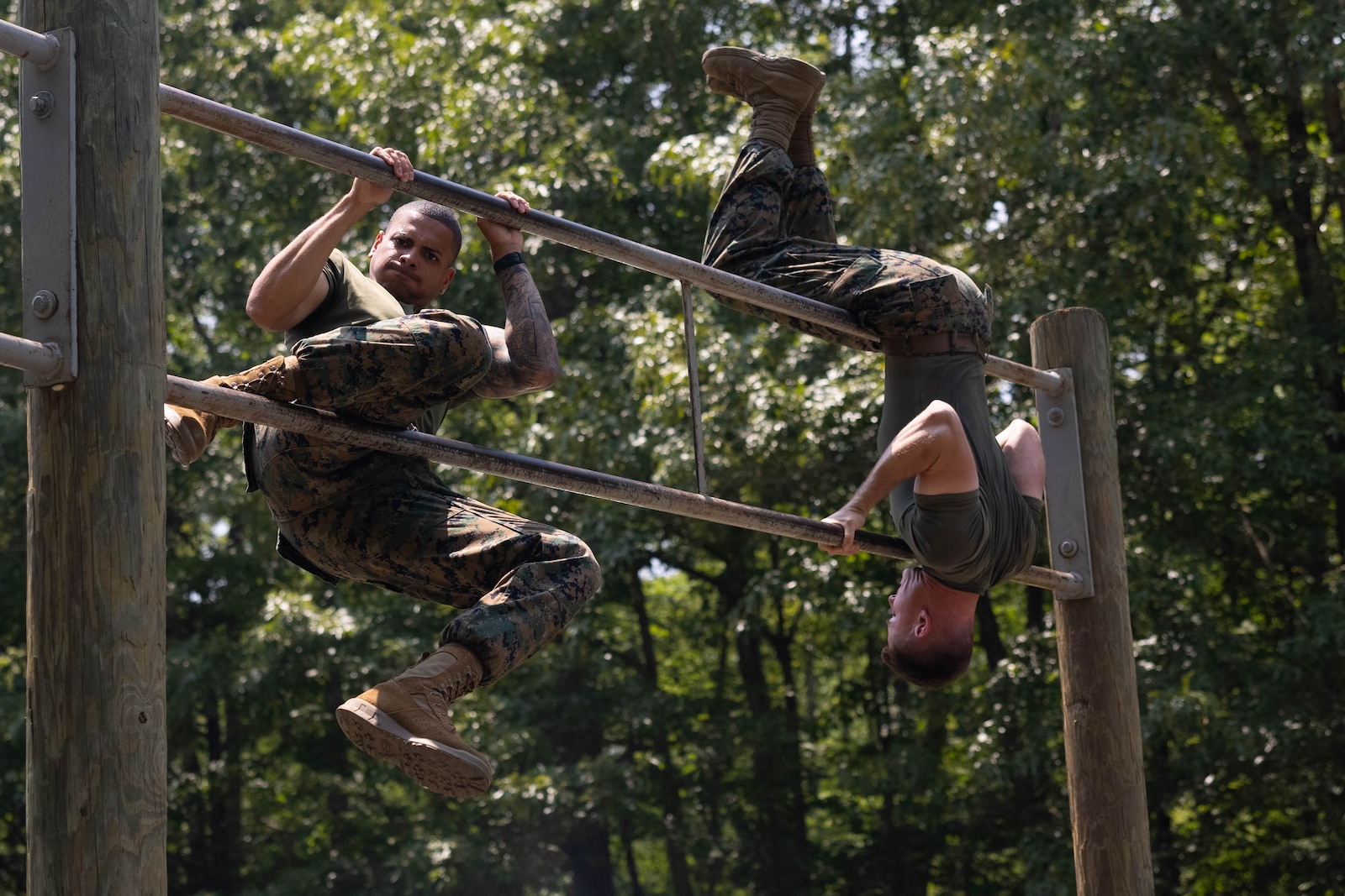 Students with the Force Fitness Instructor Course 3-25 navigate through the obstacle course at The Basic School on Marine Corps Base Quantico, Virginia, June 12, 2025. The FFI course trains Marines to improve their warfighting capability to maximize unit physical readiness and optimize mental and physical performance. (U.S. Marine Corps photo by Pfc. Camila Garibay)