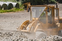 U.S. Air Force 2nd Lt. Cedar Miller, assigned to the 124th Civil Engineer Squadron, Idaho Air National Guard, transports materials to be used for a new road as part of the Redwoods Rising Innovative Readiness Training mission in California’s Redwood National and State Parks on June 17, 2025.