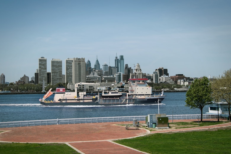 Rendering shows a dredge with the city of Philadelphia in background