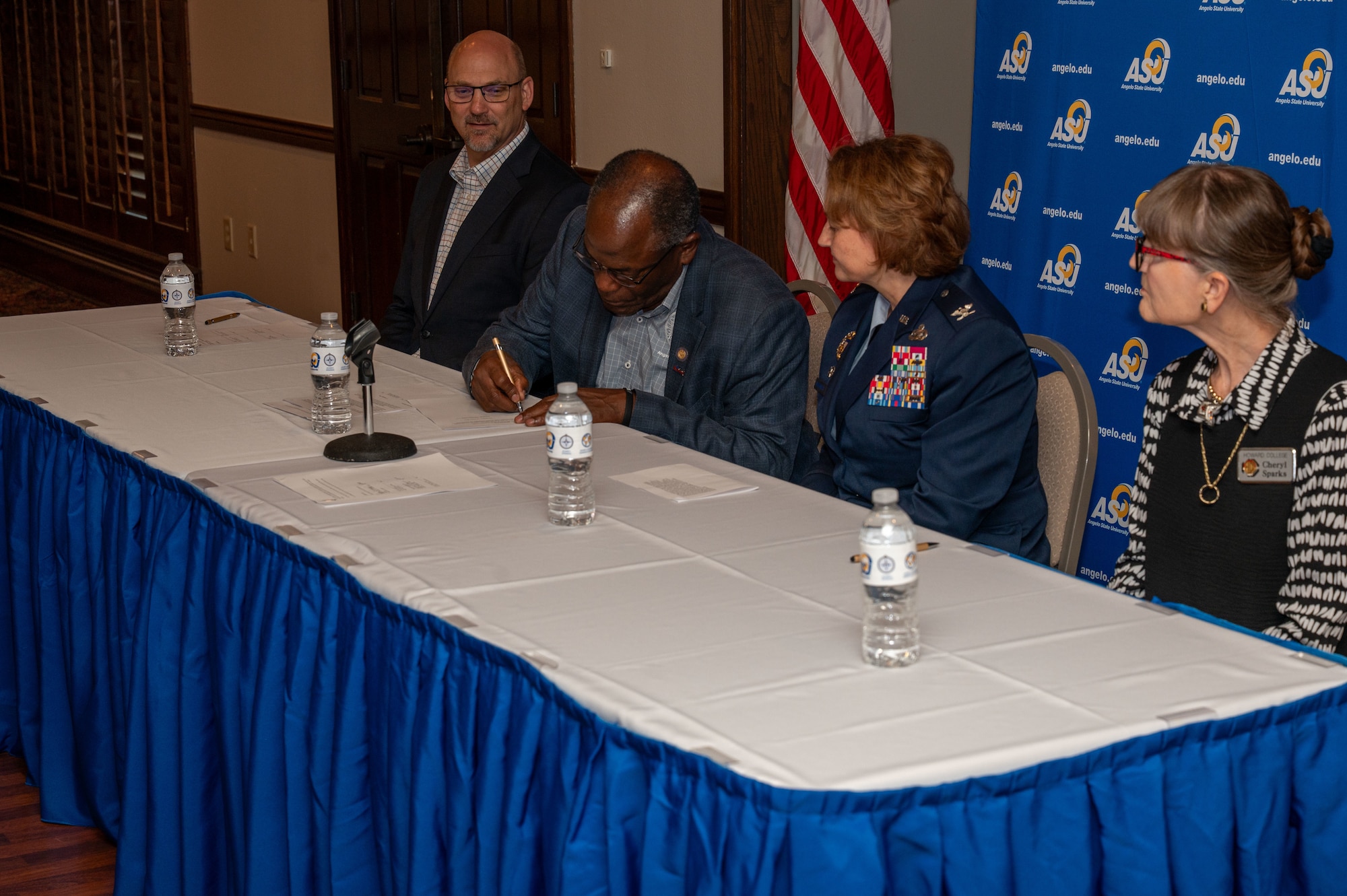 Ronnie D. Hawkins Jr., Angelo State University president, signs a Memorandum of Understanding alongside Dr. Christopher Moran, San Angelo ISD superintendent, U.S. Air Force Col. Angelina Maguinness, 17th Training Wing commander and Dr. Cheryl Sparks, Howard College president at the Memorandum of Understanding event between Goodfellow Air Force Base and Angelo State University at the LeGrand Visitors and Alumni Center, San Angelo Texas, June 18, 2025. A new agreement between ASU and Goodfellow AFB allows students completing U.S. Air Force enlisted intelligence training in qualifying Air Force Specialty Codes to receive credit hours towards a bachelor’s degrees in ASU’s Department of Security Studies and Criminal Justice. (U.S. Air Force photo by Airman 1st Class James Salellas)