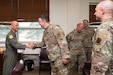 Air Force Maj. Gen. Terrence L. Koudelka, Jr., Deputy Adjutant General-Air and Commander of the Pennsylvania Air National Guard, coins Chief Warrant Officer 2 Jonathan DeRivera during a recognition event at Biddle Air National Guard Base, Pennsylvania, May 29, 2025. Maj. Gen. Koudelka recognized both DeRivera and Chief Warrant Officer 2 Brian Mundorff for their historic appointments as the first warrant officers in the Pennsylvania Air National Guard since the rank was reinstated, honoring their leadership and expertise as 17Y and 17W warrant officers. (U.S. Air National Guard photo by Airman 1st Class Matthew Bergh)