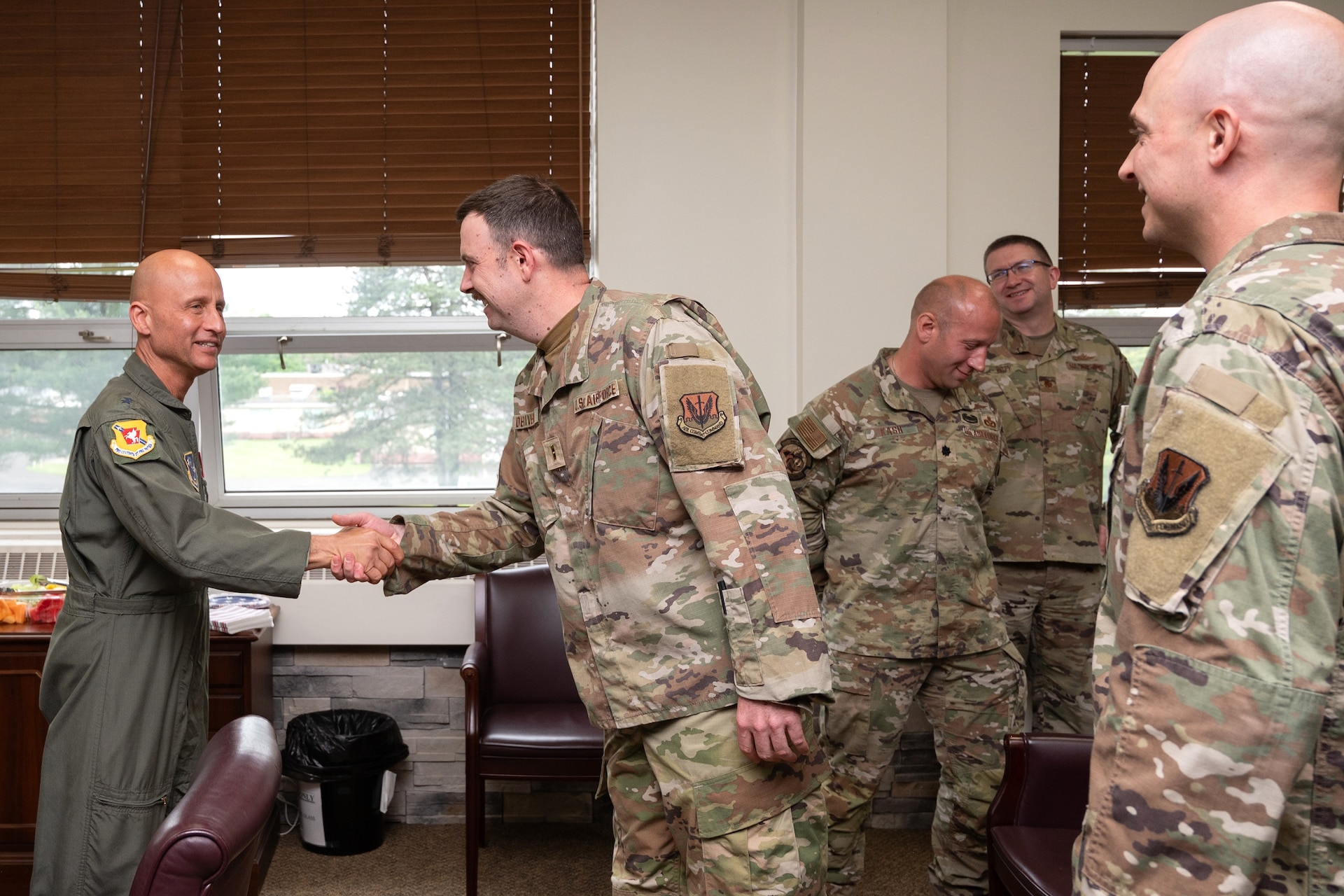 Air Force Maj. Gen. Terrence L. Koudelka, Jr., Deputy Adjutant General-Air and Commander of the Pennsylvania Air National Guard, coins Chief Warrant Officer 2 Jonathan DeRivera during a recognition event at Biddle Air National Guard Base, Pennsylvania, May 29, 2025. Maj. Gen. Koudelka recognized both DeRivera and Chief Warrant Officer 2 Brian Mundorff for their historic appointments as the first warrant officers in the Pennsylvania Air National Guard since the rank was reinstated, honoring their leadership and expertise as 17Y and 17W warrant officers. (U.S. Air National Guard photo by Airman 1st Class Matthew Bergh)