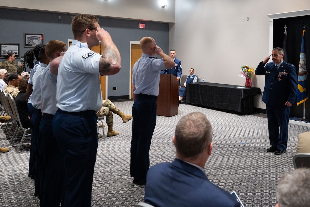 U.S. Air Force Airmen assigned to the 17th Medical Group present Col. Ian Rybczynski, outgoing 17th Medical Group commander, with his final salute upon relinquishing command at the Powell Event Center, Goodfellow Air Force Base, Texas, June 18, 2025. The 17th MDG houses the 17th Medical Operational Readiness Squadron and the 17th Healthcare Operations Squadron that provides primary care to TRICARE patients, including active duty, dependents, and retirees. (U.S. Air Force Photo by Airman 1st Class Brian Lummus)