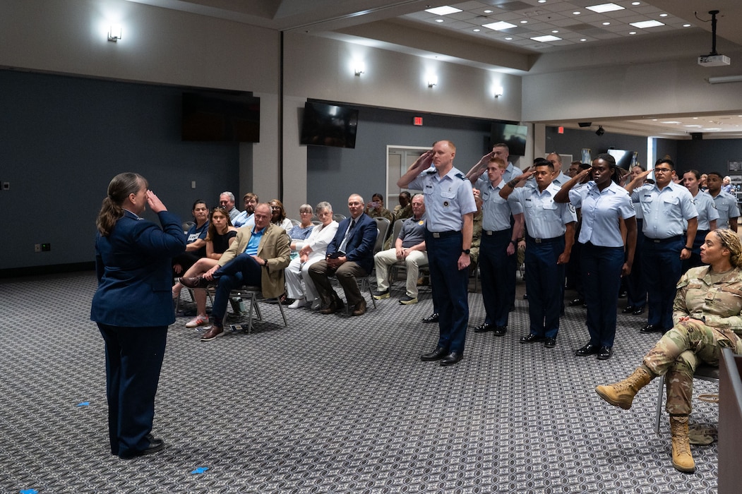 U.S. Air Force Airmen assigned to the 17th Medical Group present Col. La Rita Abel, 17th Medical Group commander, with her first salute upon taking command at the Powell Event Center, Goodfellow Air Force Base, Texas, June 18, 2025. The 17th MDG houses the 17th Medical Operational Readiness Squadron and the 17th Healthcare Operations Squadron that provides primary care to TRICARE patients, including active duty, dependents, and retirees. (U.S. Air Force Photo by Airman 1st Class Brian Lummus)