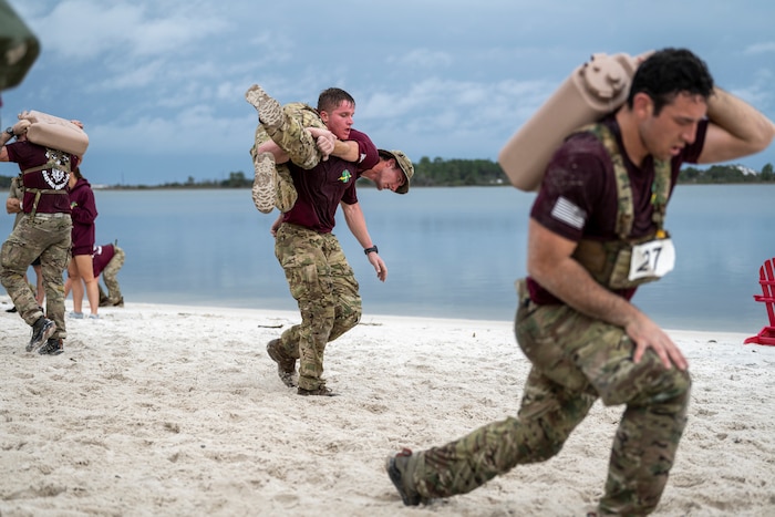 U.S. Airmen assigned to the 24th Special Operations Wing participate in a beach challenge during the 2025 Chapman Competition at Hurlburt Field, Florida,