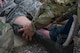An Airman from the 5th Medical Group places a splint on a simulated broken ankle during a training event at Minot Air Force Base, North Dakota, June 11, 2025. The 5MDG holds training once a week to teach Airmen new skills and to reinforce previously taught skills such as wound recognition and treatment. (U.S. Air Force photo by Airman 1st Class Wesley Davies)