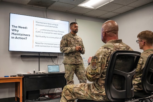 U.S. Air Force Capt. Renny Cherian, 355th Maintenance Group chaplain, briefs maintainers during the Maintainers in Action kick off event at Davis-Monthan Air Force Base, Arizona, June 12, 2025. Chaplains and Religious Affairs Airmen serve as sensors for Group and Squadron leaders and offer 100% confidential counseling to Airmen and their families. (U.S. Air Force photo by Airman Samantha Melecio)