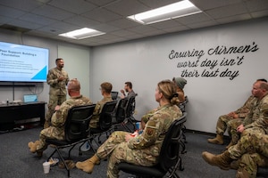 U.S. Air Force Capt. Renny Cherian, 355th Maintenance Group chaplain, briefs maintainers during the Maintainers in Action kick off event at Davis-Monthan Air Force Base, Arizona, June 12, 2025. This peer-to-peer mentorship program extends the reach of the Religious Support Team, ensuring all Airmen have access to resources and support, while building a stronger, more resilient maintenance community, reinforcing positivity on the flightline. (U.S. Air Force photo by Airman Samantha Melecio)
