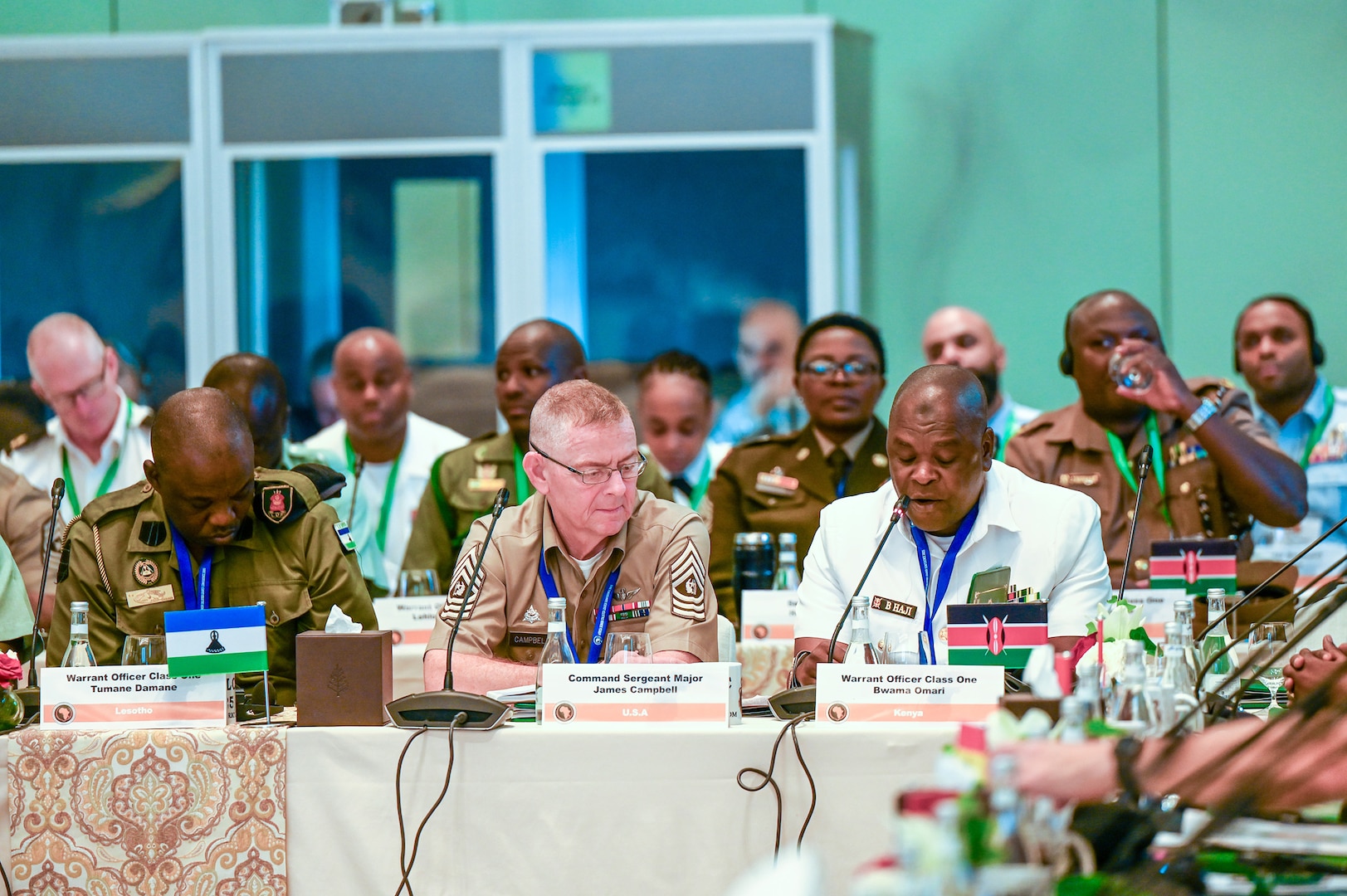 Command Sgt. Maj. James Campbell, the Massachusetts National Guard’s senior enlisted leader, listens to Warrant Officer Bwama Omari from Kenya during the 2025 African Senior Enlisted Leader Conference, in Rabat, Morocco, June 12. SEA John Raines, the senior enlisted advisor to the chief of the National Guard Bureau, attended the conference as the keynote speaker.