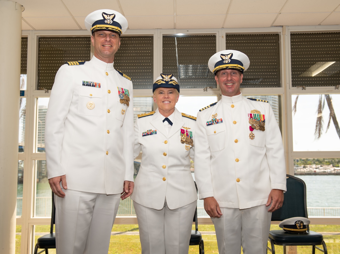 Military members stand for a photo at a ceremony