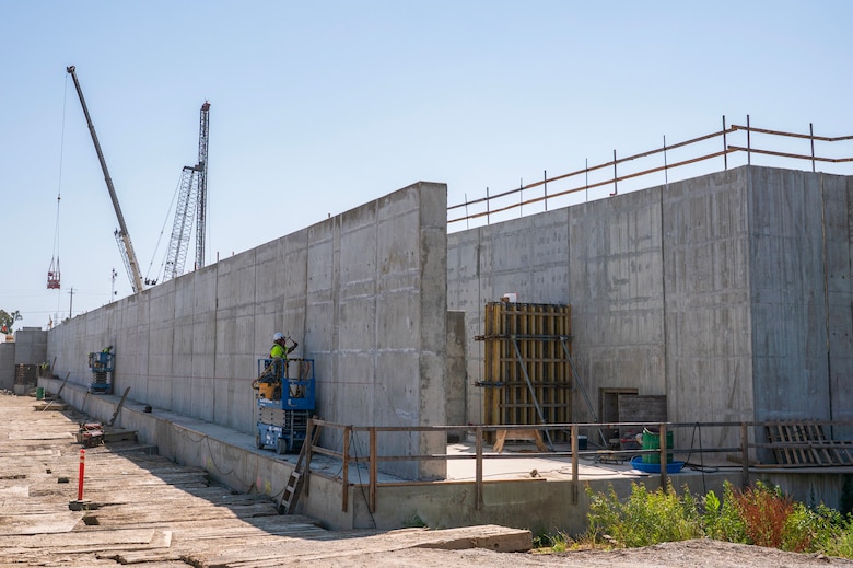 Construction crews work on the fish passage structure along the west bank of the Sacramento River in Yolo County, California, on June 5, 2025. The structure is part of the Sacramento Weir Widening Project managed by the U.S. Army Corps of Engineers Sacramento District, which will create an 8,600-foot "double hybrid technical fishway" for endangered salmon, steelhead and sturgeon. The $350 million project combines flood control infrastructure with fish passage capabilities to protect threatened species during high-water events.