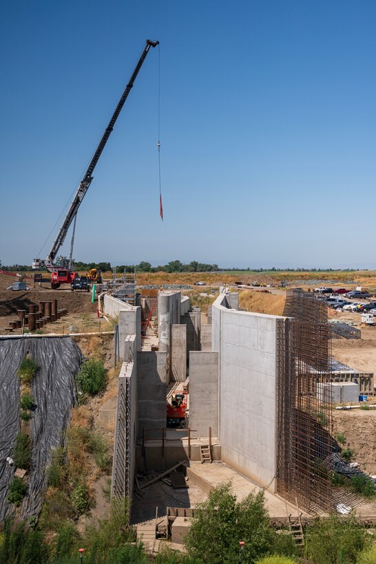 The fish passage structure stands along the west bank of the Sacramento River in Yolo County, California, on June 5, 2025. The structure is part of the Sacramento Weir Widening Project managed by the U.S. Army Corps of Engineers Sacramento District, which will create an 8,600-foot "double hybrid technical fishway" for endangered salmon, steelhead and sturgeon. The $350 million project combines flood control infrastructure with fish passage capabilities to protect threatened species during high-water events.
