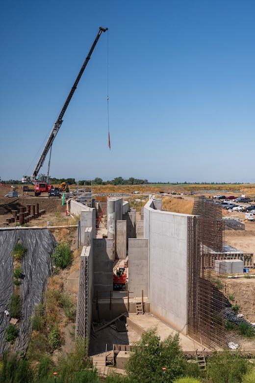The fish passage structure stands along the west bank of the Sacramento River in Yolo County, California, on June 5, 2025. The structure is part of the Sacramento Weir Widening Project managed by the U.S. Army Corps of Engineers Sacramento District, which will create an 8,600-foot "double hybrid technical fishway" for endangered salmon, steelhead and sturgeon. The $350 million project combines flood control infrastructure with fish passage capabilities to protect threatened species during high-water events.