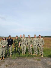 Lt. Xuan Li, Lt. Randy Buckley, Hospital Corpsman 1st Class Nicolas Garhartt, and Hosptial Corpsman 2nd Class Alexis Rivera, assigned to Navy Environmental Preventive Medicine Unit TWO (NEPMU-2), along with Sailors from 22 Naval Construction Regiment and Swedish military personnel pose for a group photo while conducting a expeditionary medical facility survey during BALTOPS25 in Rinkaby, Sweden, June 19, 2025. BALTOPS 25 is the premier maritime-focused annual military exercise in the Baltic region and provides a unique opportunity to strengthen warfighting readiness and combat credibility critical to deterrence and preserving safety and security in the Baltic Sea.